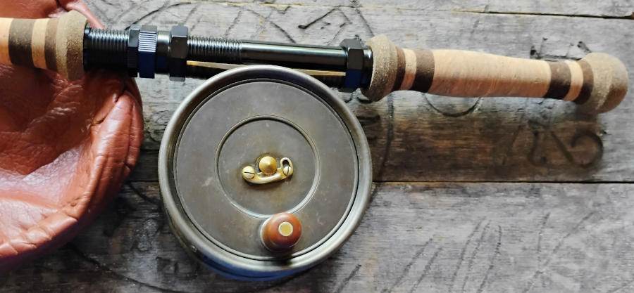 fly reel attached to hex head all purpose reel seat mounted on two-handed fly rod